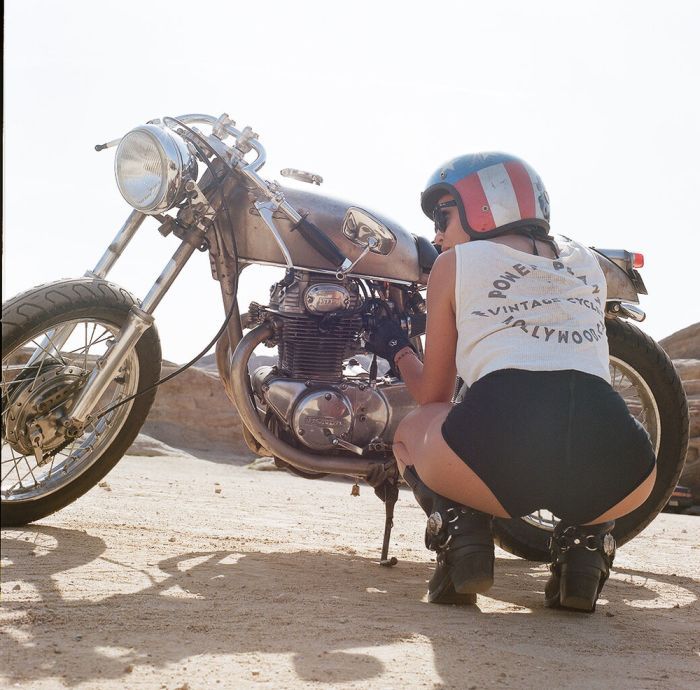 A playful frame from Girls on a motorcycle — online in Salem